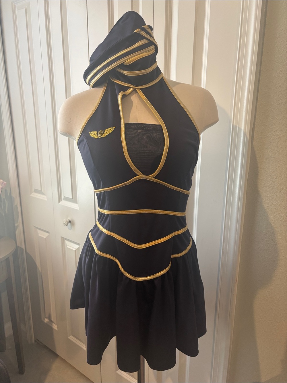 Halloween Costumes- Flight Attendant.
Navy and gold mini dress with matching hat